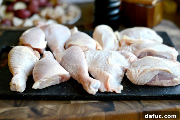 Slow-Simmered Chicken Stew 6 Bone-in, skin-on chicken thighs and drumsticks on a cutting board