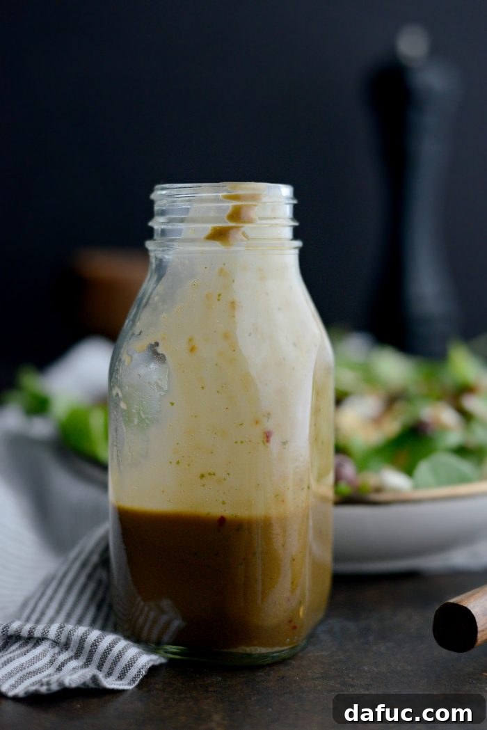 Sweet Basil Vinaigrette in a glass jar, ready to be served