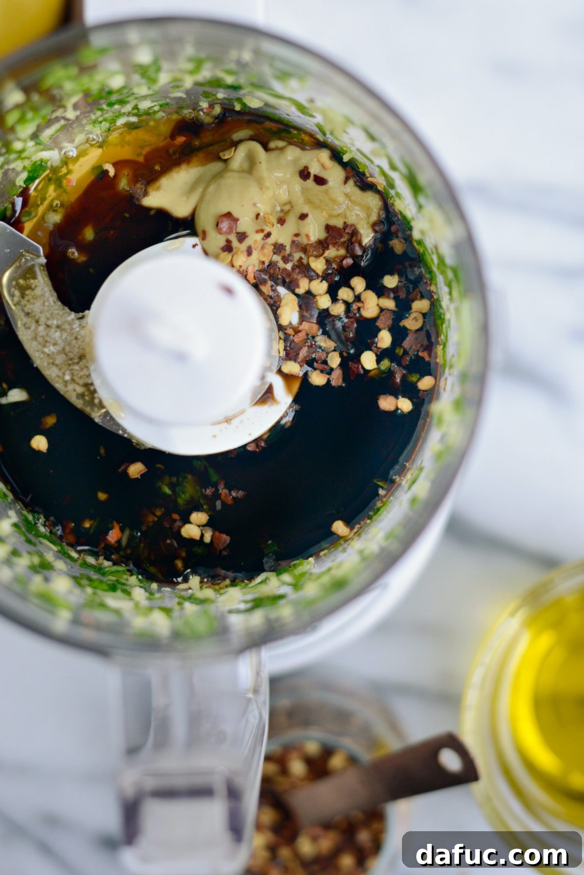 All ingredients for Sweet Basil Vinaigrette laid out on a counter