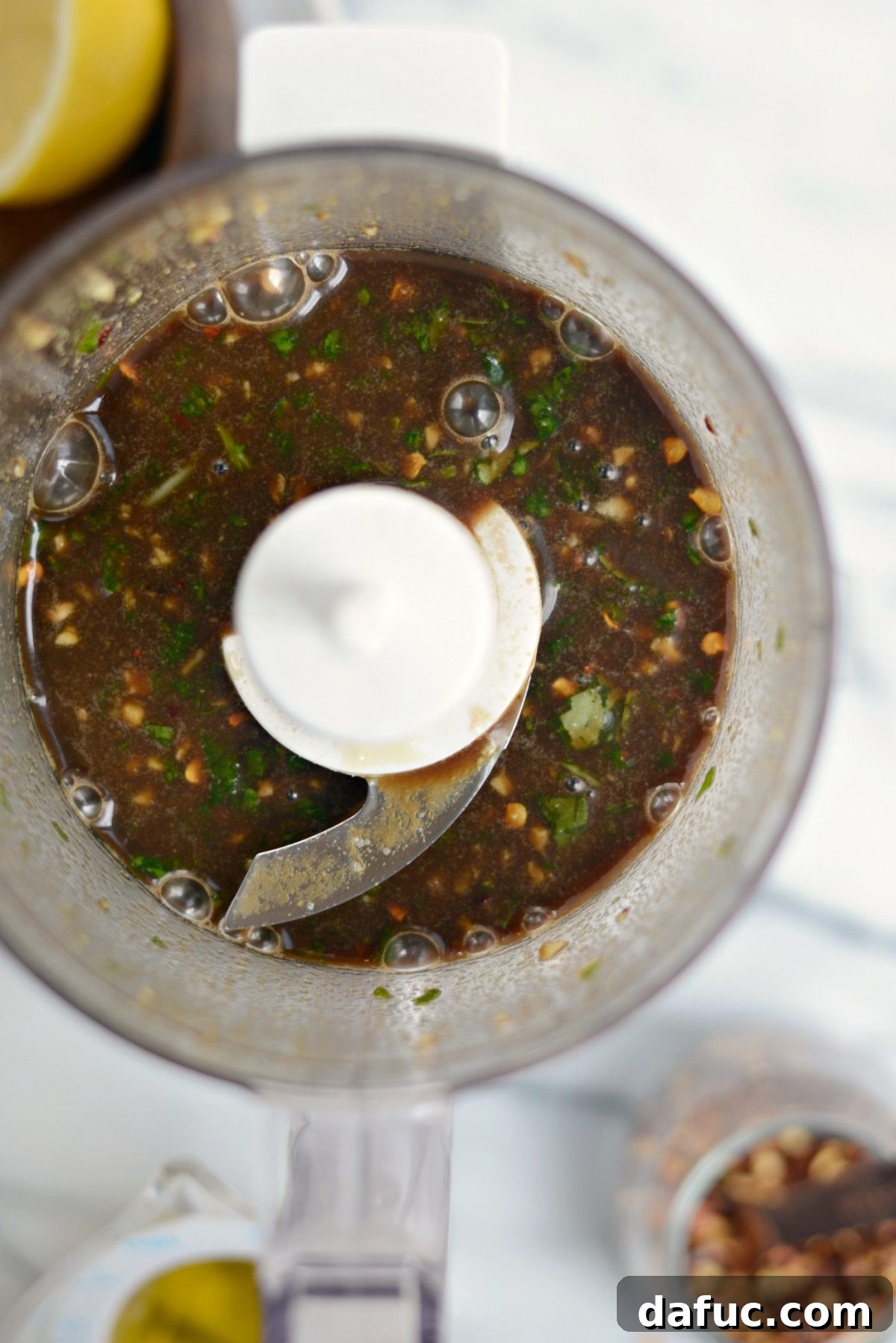 Garlic, basil, honey, balsamic, and lemon juice pulsed in a food processor