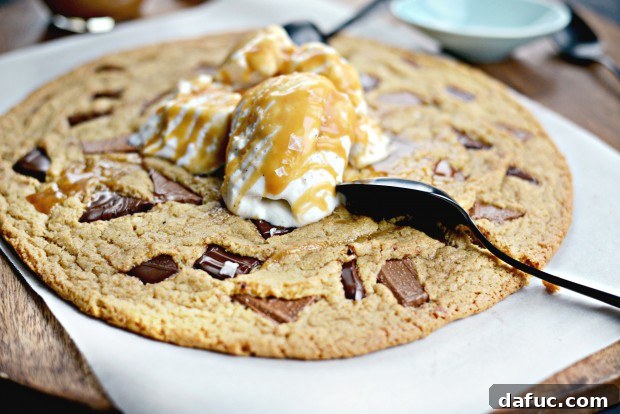 The Ultimate Double Chocolate Chunk Share Cookie served with vanilla ice cream and caramel