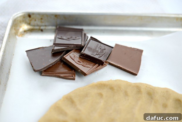 Cookie dough patted into a 10-inch circle on parchment paper