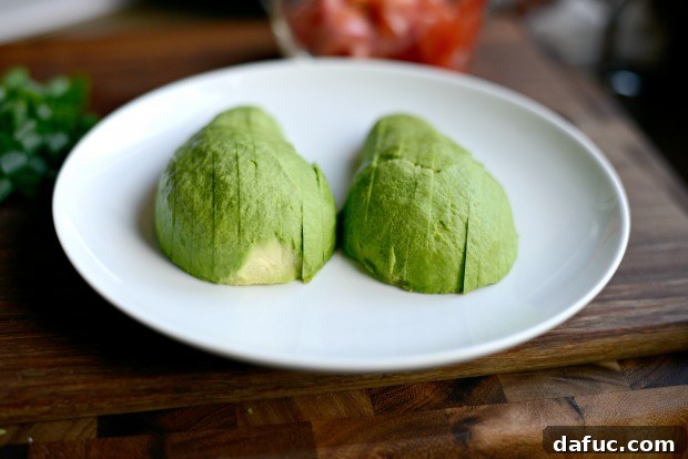 Thinly sliced avocado on a cutting board