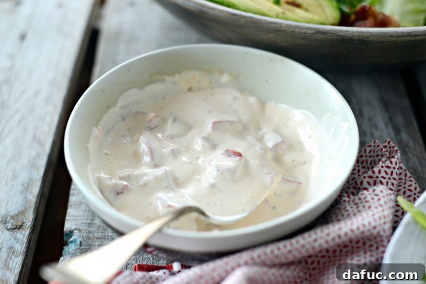 A serving of BLAT salad with a generous dollop of dressing
