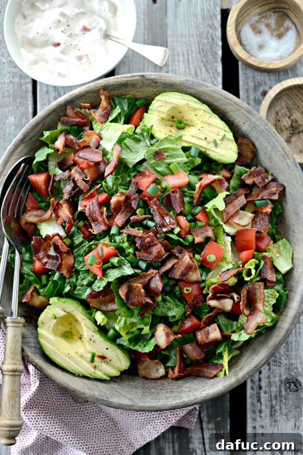 Close-up of freshly prepared BLAT salad, showing layers of ingredients