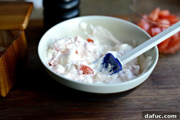 Tomato and mayonnaise dressing chilling in a bowl