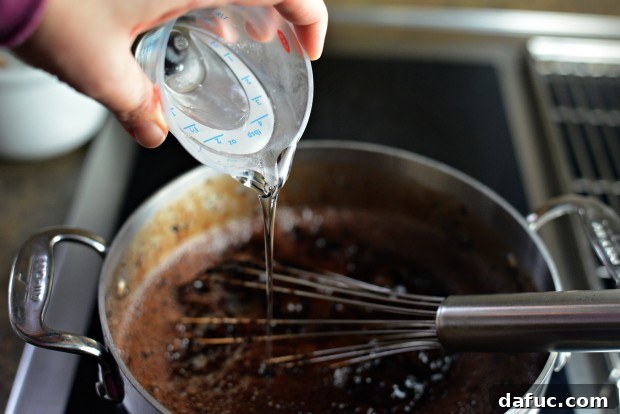 Cocoa powder being incorporated into syrup