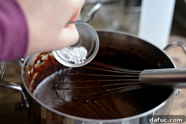 Adding vanilla extract to chocolate syrup