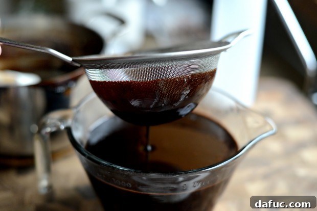 Straining homemade chocolate syrup