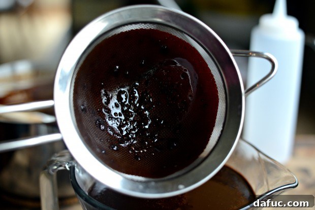 Solids collected in strainer from chocolate syrup