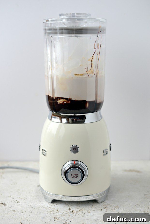 Chocolate Banana Bliss 9 Adding ice cubes to the blender for a milkshake