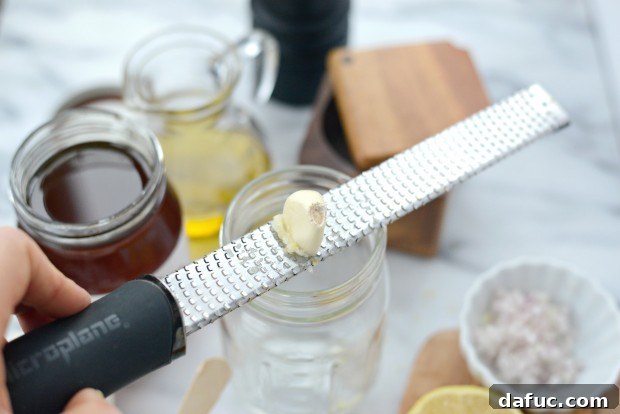 Ingredients for Easy Lemon Vinaigrette in a glass jar