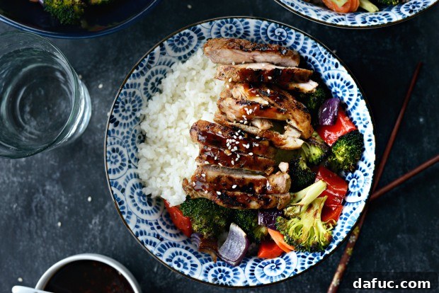 Sweet & Tangy Teriyaki Chicken Bowls 2 Grilled Teriyaki Chicken Rice Bowls - Appetizing close-up of a finished bowl