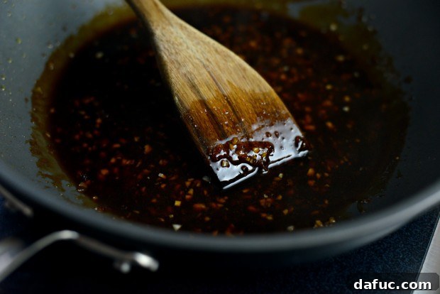 Sweet & Tangy Teriyaki Chicken Bowls 14 Teriyaki sauce thickening - sauce bubbling in the pan with cornstarch slurry