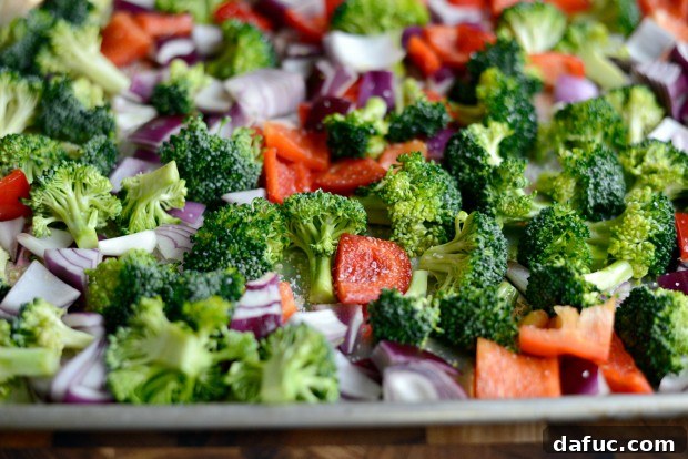 Sweet & Tangy Teriyaki Chicken Bowls 7 Oiled and salted vegetables - close-up of seasoned veggies on a sheet pan