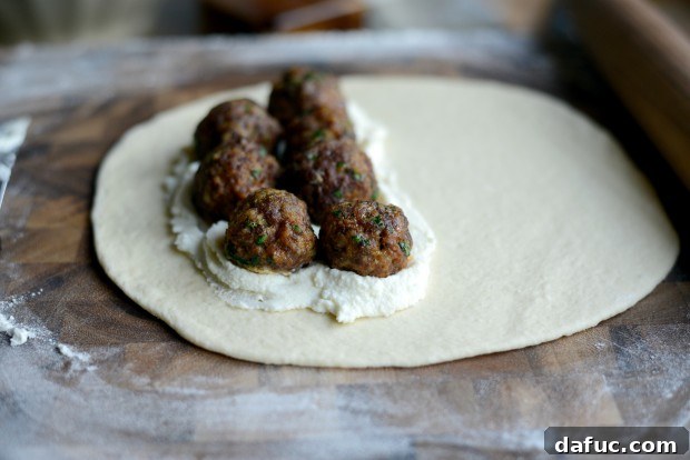 Adding meatballs to calzone filling