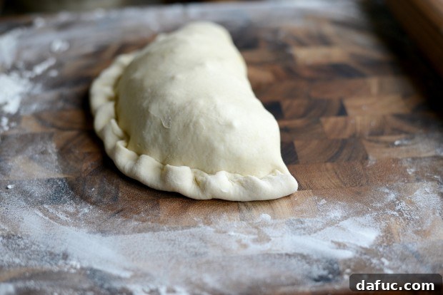 Tucking calzone edge underneath