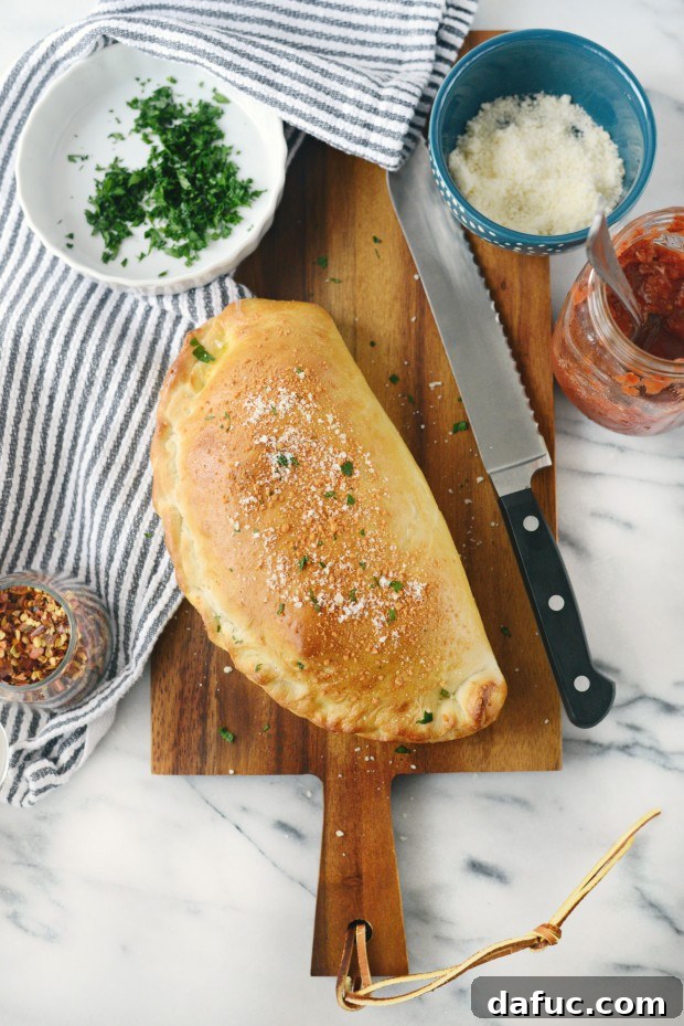 Cutting an Italian Meatball Calzone in half