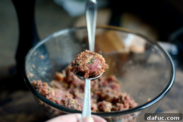 Scooping meatball mixture