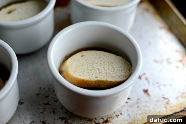 French Bread Slice Placed on Soup