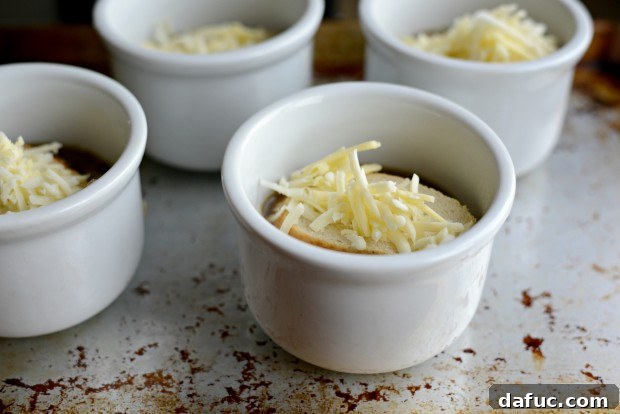 Adding Cheese over French Bread on Soup