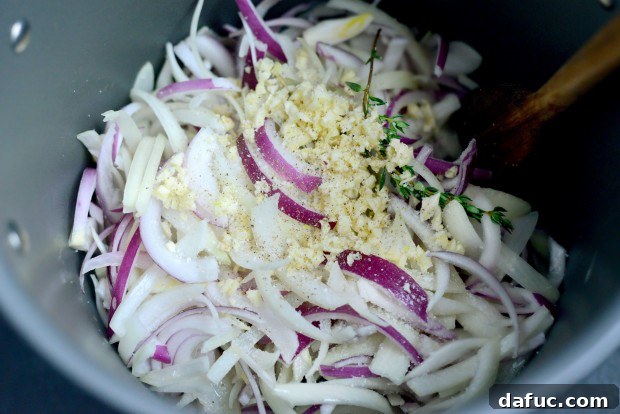 Minced Garlic, Salt, and Pepper Added to Onions