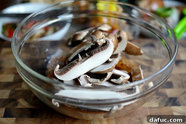 Adding portobello mushroom slices to the fajita seasoning mixture