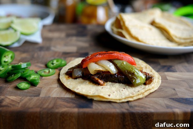 Adding charred peppers and onions to Portobello Fajitas