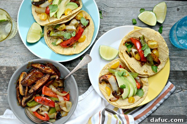 Beautifully garnished Portobello Fajitas with avocado, tomatoes, and cilantro