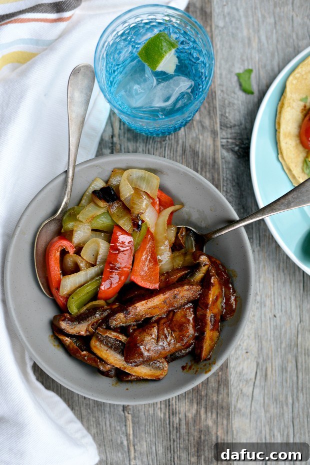 Overhead shot of two Portobello Fajitas with all toppings