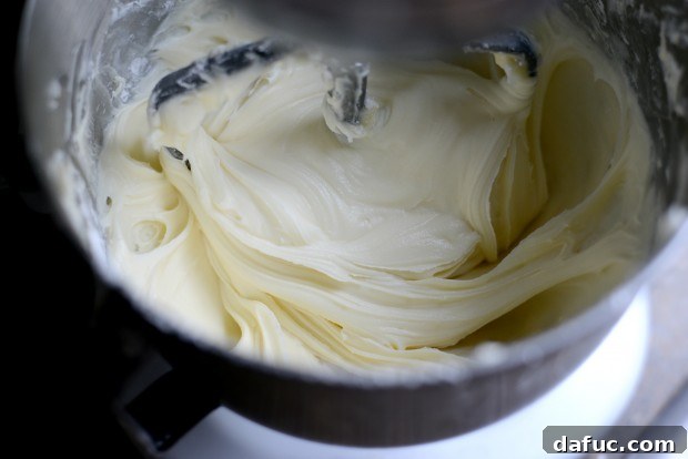 Ultimate Classic Cream Cheese Frosting 11 Final scraping of the bowl after adding sugar