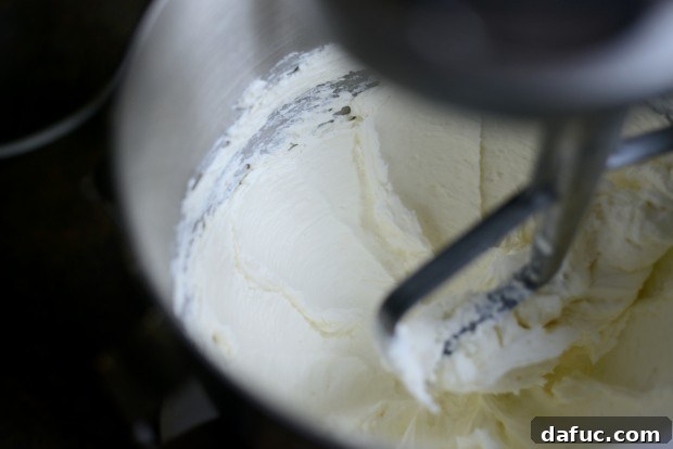 Ultimate Classic Cream Cheese Frosting 6 Cream cheese mixing in a stand mixer