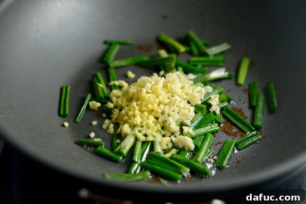 Vibrant Spring Chicken Soba Stir-Fry 11 Chicken browning in a hot wok for a soba noodle stir-fry