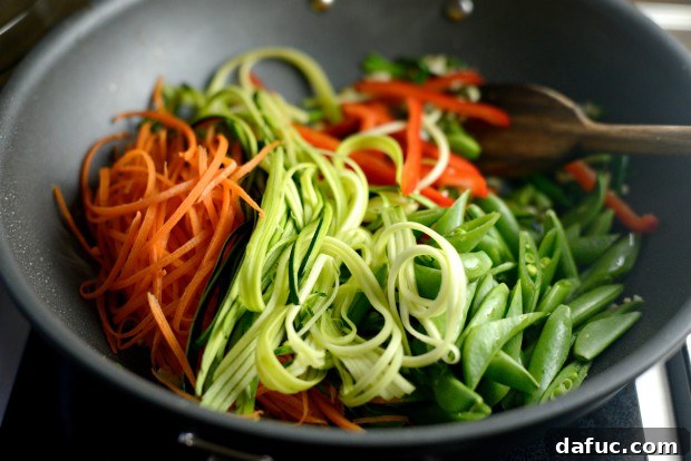 Vibrant Spring Chicken Soba Stir-Fry 13 Aromatics pushed to the side of the wok, ready for vegetables