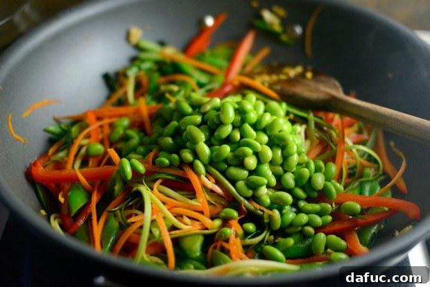 Vibrant Spring Chicken Soba Stir-Fry 15 Vegetables glistening and tender-crisp in the wok