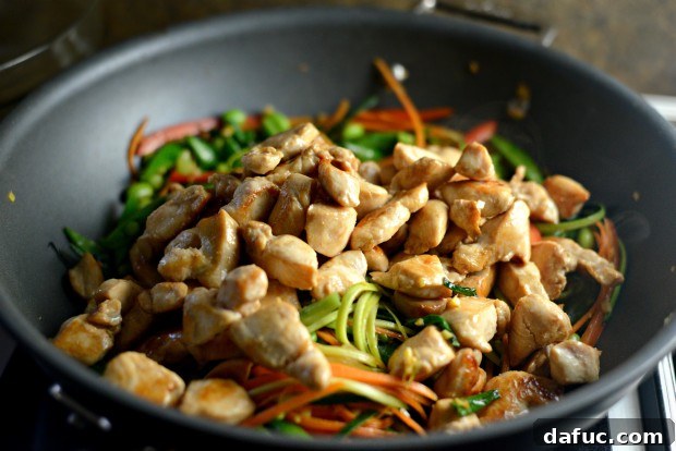 Vibrant Spring Chicken Soba Stir-Fry 16 Adding thawed shelled edamame to the stir-fry