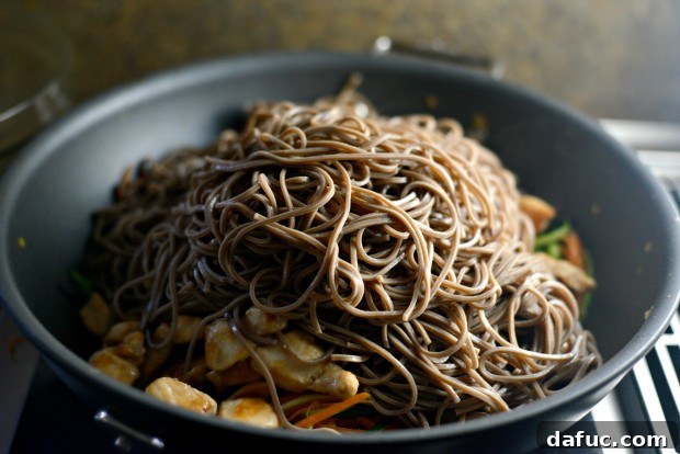 Vibrant Spring Chicken Soba Stir-Fry 17 Cooked chicken added back to the stir-fry with vegetables