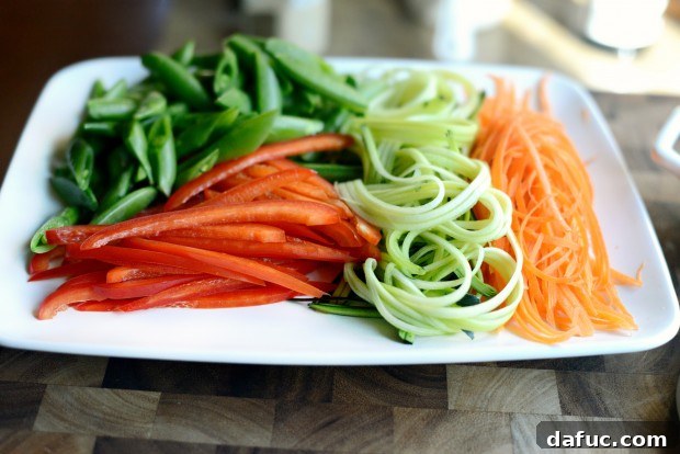 Vibrant Spring Chicken Soba Stir-Fry 4 Chicken and Spring Vegetable Soba Noodle Stir-Fry with julienned vegetables