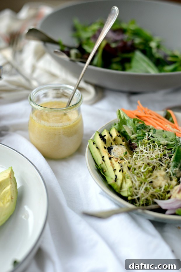 Shaved Raw Sweet Potato and Creamy Avocado Salad with Miso Dressing 22 A final close-up of the Avocado and Raw Sweet Potato Salad with Miso Dressing, garnished with sesame seeds.