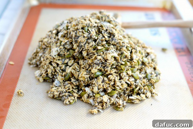 Tropical Coconut Chia Granola 14 Final mixing of Coconut Chia Granola before baking