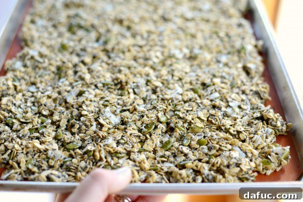 Tropical Coconut Chia Granola 16 Evenly spreading granola for optimal baking