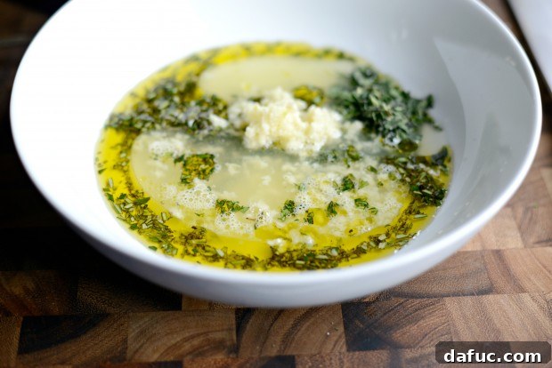 Zesty Grilled Greek Chicken 11 Adding garlic and olive oil to the minced herbs