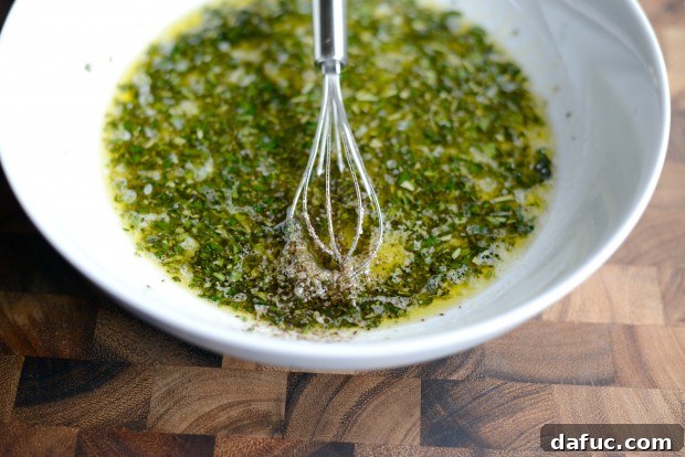 Zesty Grilled Greek Chicken 12 Squeezing fresh lemon juice into the marinade ingredients