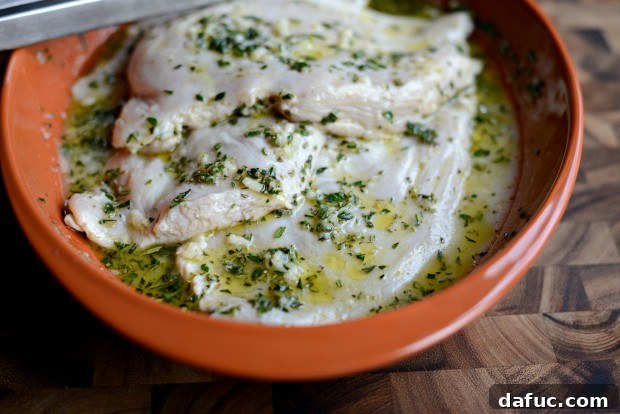 Zesty Grilled Greek Chicken 15 Tossing chicken in the marinade to ensure even coating