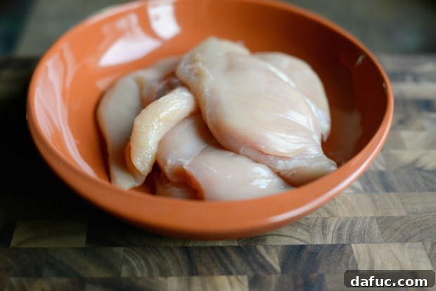 Zesty Grilled Greek Chicken 5 Pounding chicken breasts to uniform thickness for grilling