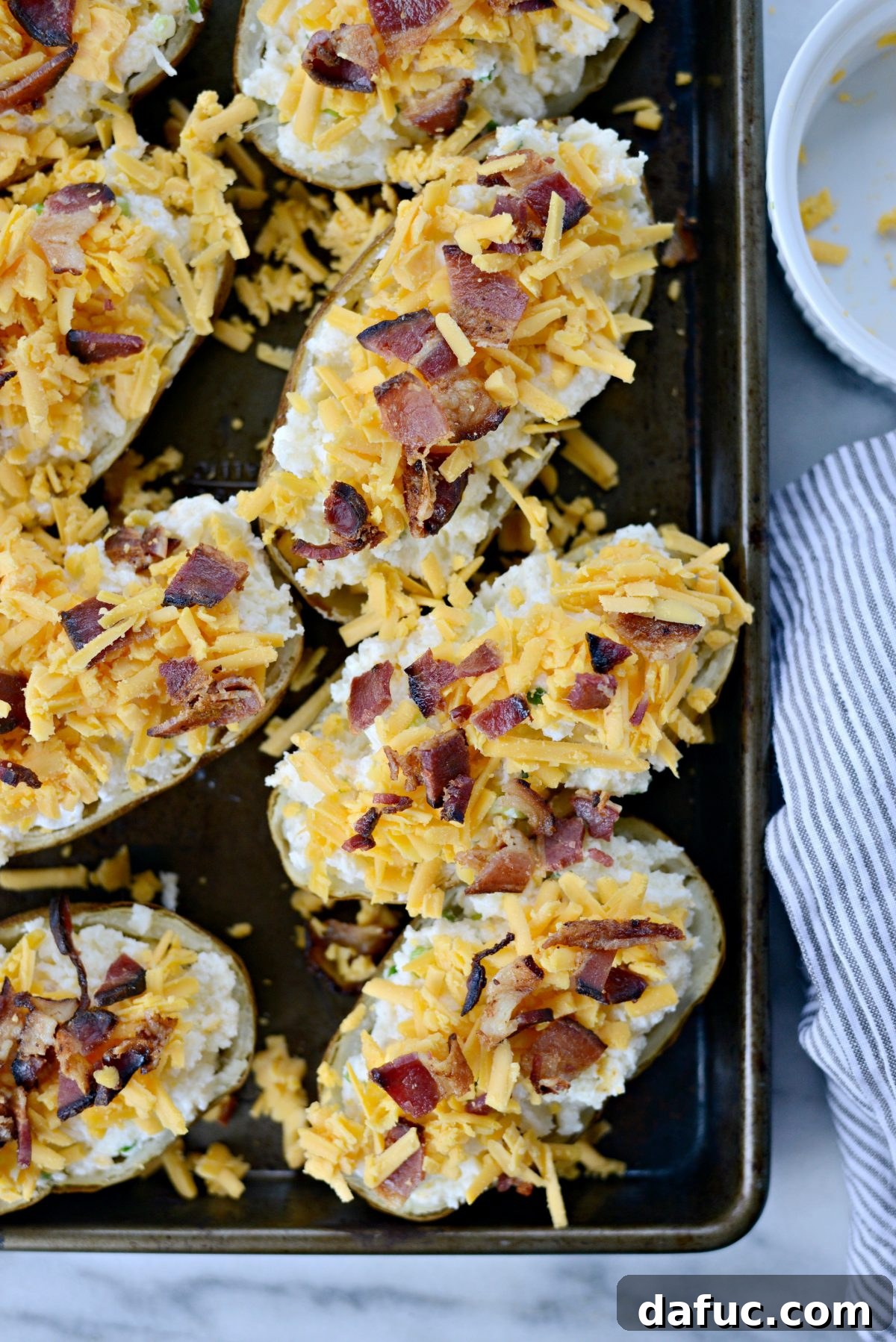 Decadent Double-Baked Potato Delight 12 Loaded potato skins topped with crispy bacon pieces