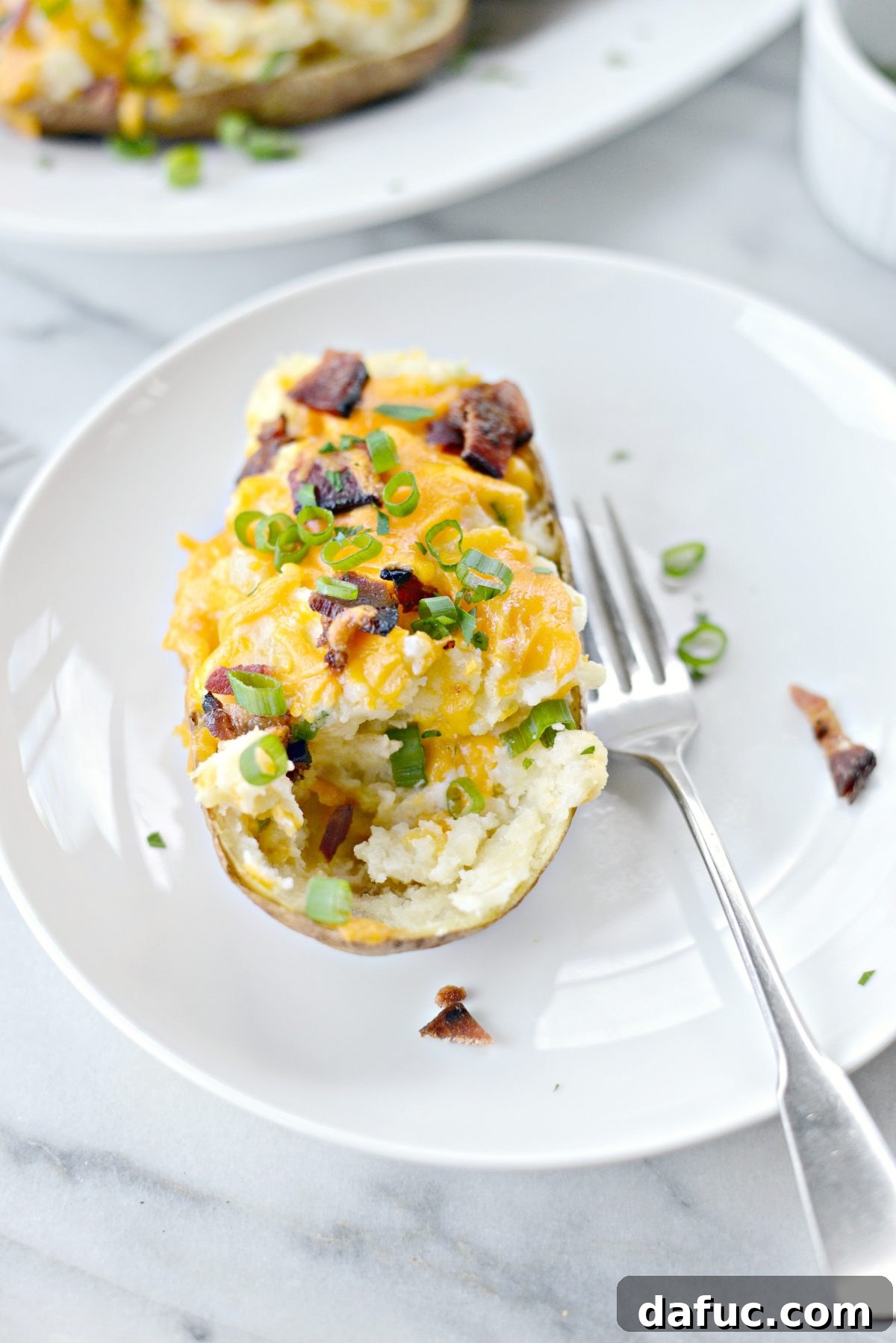Decadent Double-Baked Potato Delight 15 Beautifully plated Loaded Twice Baked Potatoes, ready to serve at a gathering