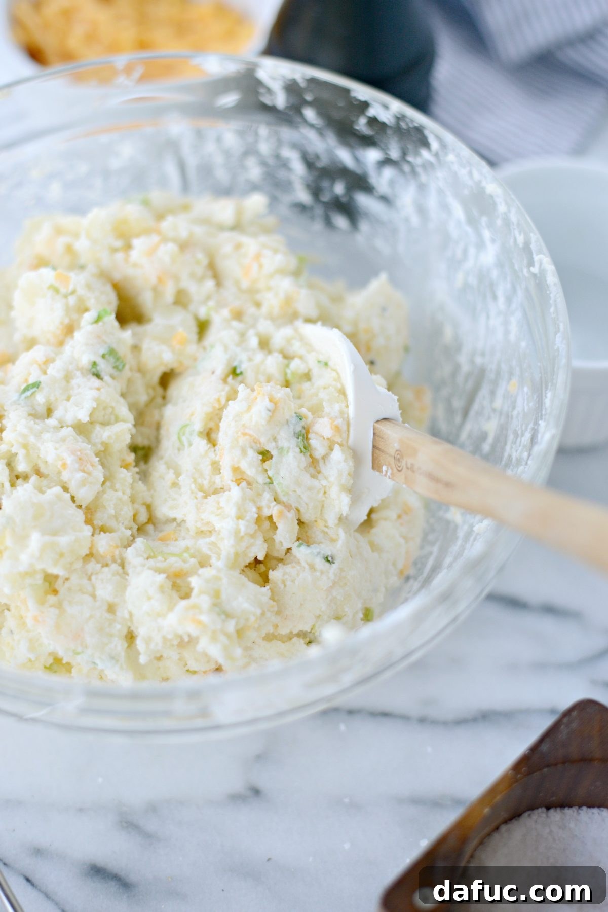 Decadent Double-Baked Potato Delight 10 Mixing the potato filling with a spatula until smooth
