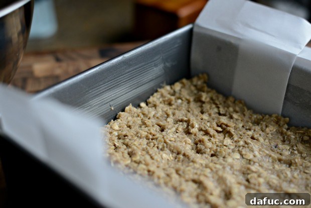 Sweet Cherry Almond Crumble Bars 12 Pressing half of the dough into the prepared baking pan