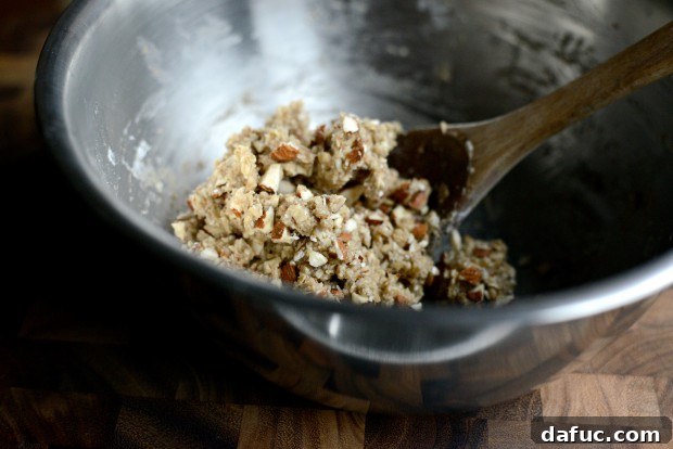 Sweet Cherry Almond Crumble Bars 14 Adding chopped almonds to the remaining dough mixture